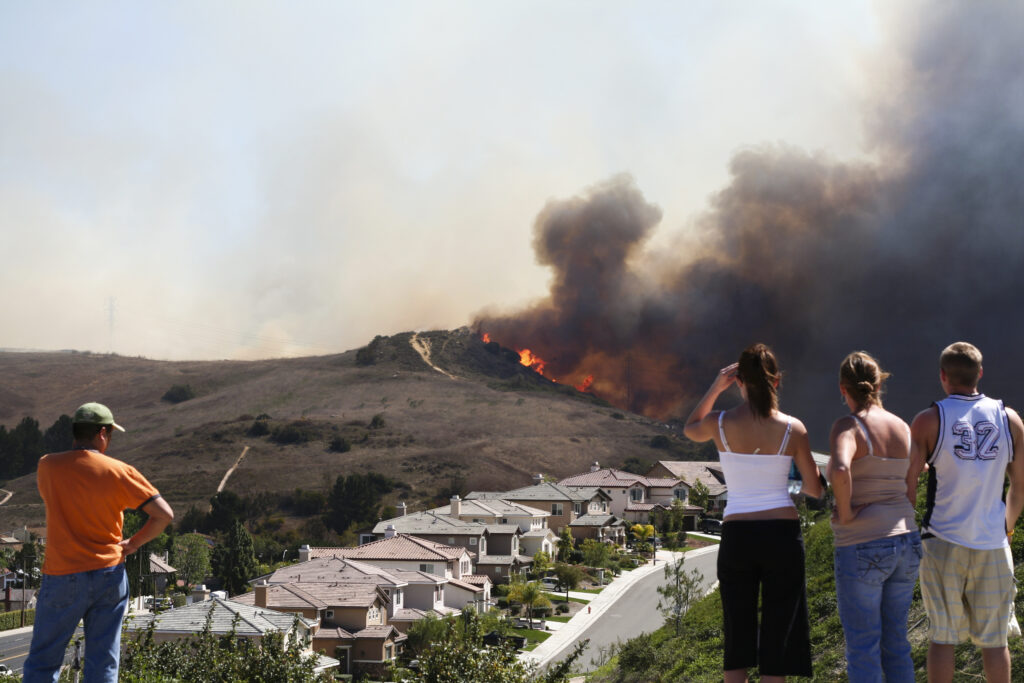 Brush fire threatening homes