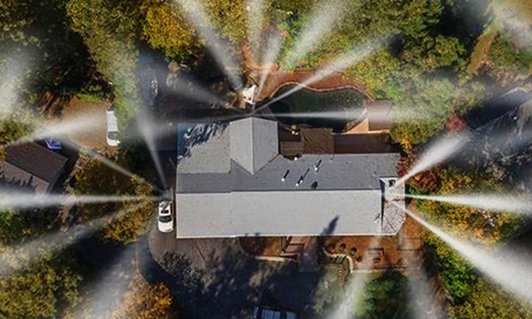 Roof and perimeter wildfire sprinkler system protecting home
